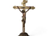 an old wooden crucif with a cross on top of it
