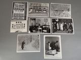 several black and white photographs of people and vehicles on a refrigerator