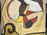 a painting that is on a easel in a room