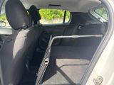 the back seat of a car with a metal bar in the back of it
