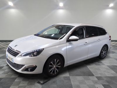 the white car is parked on a checkered tile floor