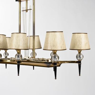 an image of a chandelier with five lamps on each side of it