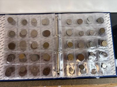 a lot of coins in a box on the table