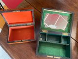 two boxes that are sitting on a table