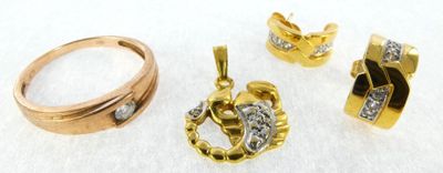 three pieces of gold and diamond jewelry on a white surface