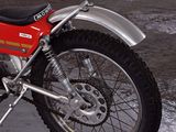 a red motorcycle that is parked in a parking lot