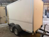 a trailer that is parked inside of a building