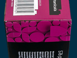a pink box with a black and white label on it