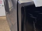 a microwave that is sitting on a table in a room