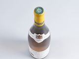 a bottle of beer that is sitting on a table