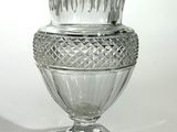 a glass vase that is sitting on top of a table