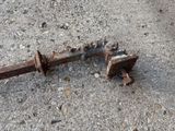 a rusted metal object that is laying on the ground