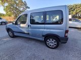 an image of a silver van parked in a parking lot