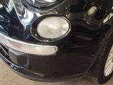 a close up of a black car with a white stripe