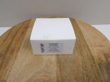 an image of a white box sitting on top of a wooden table