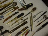 many different types of knives on the table