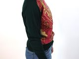 a woman that is posing for a picture wearing a sweater and jeans