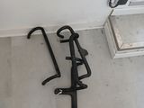 a bike rack that is on the floor next to a toilet