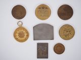 an image of a collection of medals including a medal, a medal, and a medal