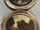 deux tableaux ovales représentant des arbres et un lac, dans un cadre doré