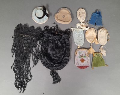 a lot of purses and hats on a table