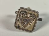 an image of a silver ring with a coat of arms on it