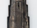 a small metal object that is sitting on a white surface