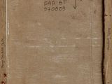 an old book with writing on it sitting on top of a table
