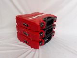four red cases stacked on top of each other on a white surface