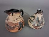 two vases that are sitting side by side on a table