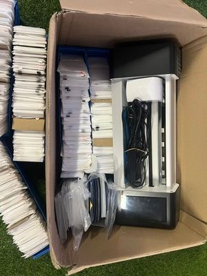 a box with a bunch of papers in it on the grass