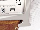 a close up of a wrist watch with a leather band