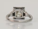 an image of a diamond ring on a white surface