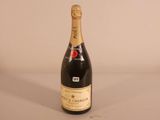 a bottle of champagne that is sitting on a table