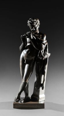 a bronze statue of a man and a woman sitting on a bench
