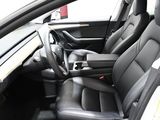 the interior of a car with black leather seats and steering controls