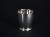 an image of a silver cup on a black background