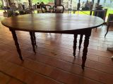a wooden table with a wooden top on a tile floor