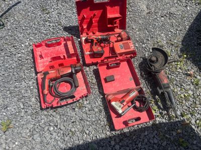 a red box with tools on the ground next to it