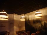 three lamps hanging from the ceiling above a dining room table