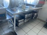 many pots and pans sitting on the kitchen counter