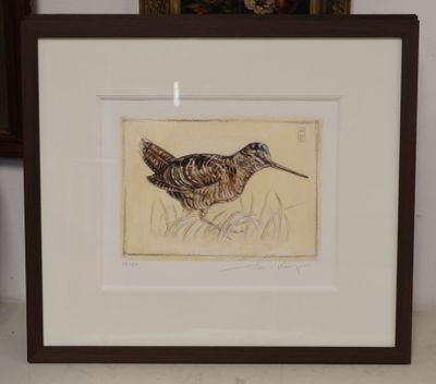 painting of a bird in a frame on a table next to a vase