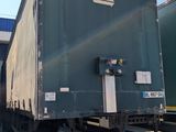 a truck that is parked next to a loading platform
