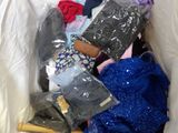 a pile of clothes in a plastic bag on the floor