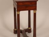 an antique wooden side table with two legs and a wooden top