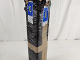 a tall black vase that is wrapped in plastic
