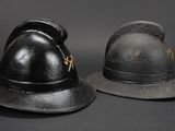two hats that are sitting next to each other on a table