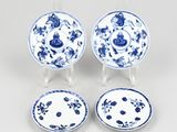 three chinese blue and white plates and a saucer