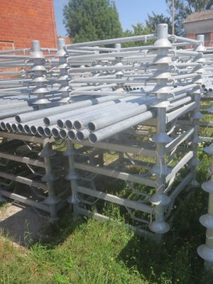 a lot of pipes that are sitting in the grass