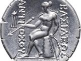 a close up of a silver coin with a man holding a sword